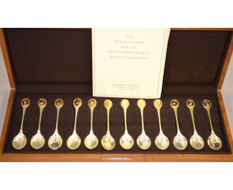 A set of 12 silver 'RSPB spoon collection', spoons in fixed wooden case, H/M London 1975, approx 320g