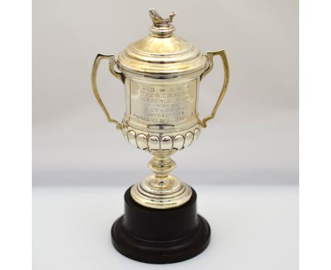 A silver two handled trophy cup & lid with fish finial & inscription, H/M Birmingham 1936, approx 132g