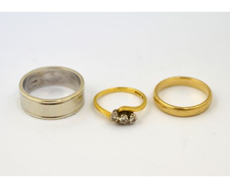 POLICE > Two 9ct H/M rings, total approx weight 13.8g, and an 18ct H/M three stone diamond ring, approx weight 2.7g. [NO RESE