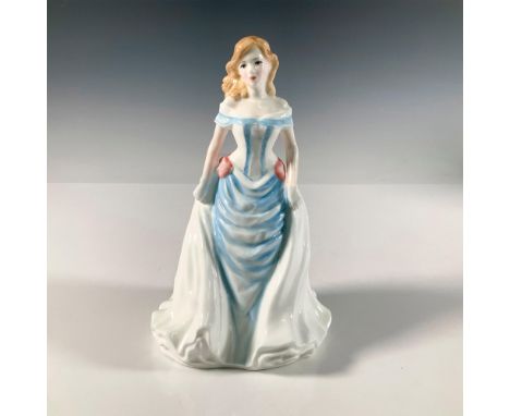 Hand painted glossy figure of a woman dressed in light blue and white gown with pink bow accents. Vanity Fair Ladies series. 