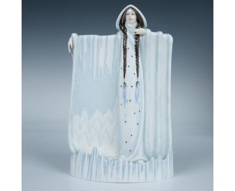 Bone china figure of a lady representing Winter with long brown braided hair in a floor length light blue and white dress. Th