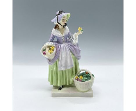 Spring blossoms fill the baskets of this pastel beauty in her light green and lavender dress. Royal Doulton backstamp. Artist