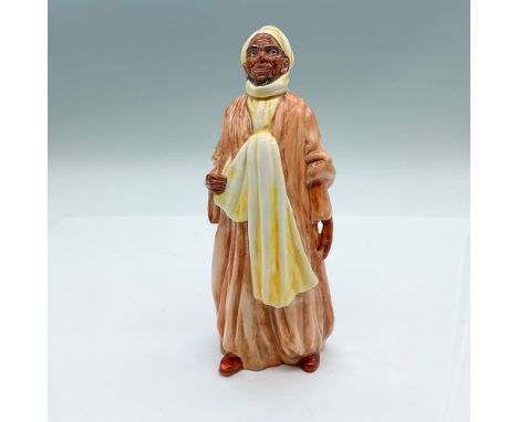 Glaze finish figure of a Middle Eastern man dressed in a thobe. Light brown dress and yellow scarf. Royal Doulton backstamp. 