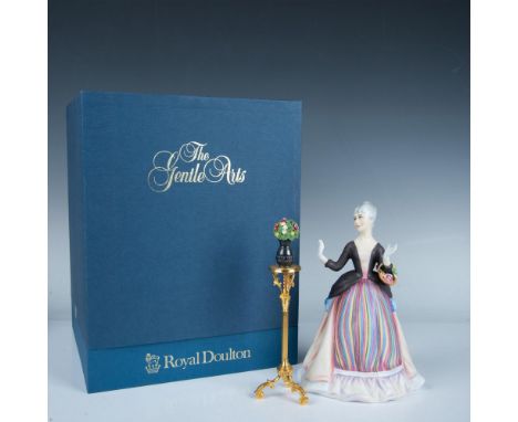 This limited edition bone China figurine is part of the Gentle Arts series. It depicts a lady wearing a striped dress carryin