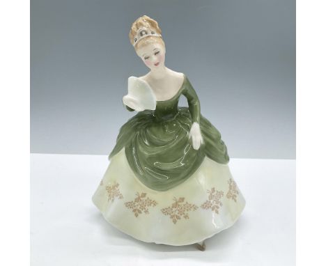 Glazed finish. Modeled in a elegant green gown decorated with a light yellow skirt with flower motifs. Royal Doulton backstam