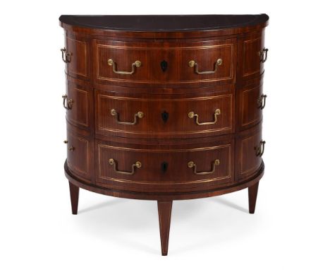 A NORTH EUROPEAN MAHOGANY AND BRASS INLAID DEMI-LUNE COMMODEPROBABLY RUSSIAN, EARLY 19TH CENTURYWith a bank of three central 