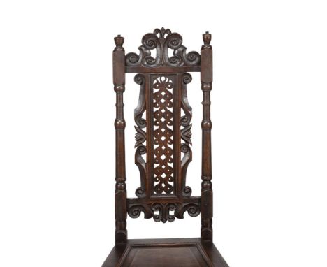 A SET OF FOUR JAMES II OAK HIGH BACK CHAIRSCIRCA 1685each 126cm high, 51cm wide, 44cm deep For a related but less elaborately