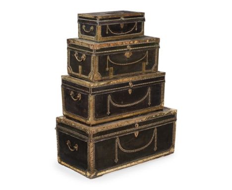 A GRADUATED SET OF FOUR LEATHER AND BRASS BOUND TRUNKSFIRST HALF 19TH CENTURYthe largest example 40cm high, 92cm wide, 46cm d