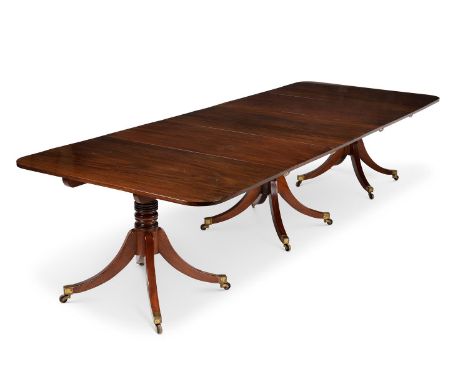 A REGENCY MAHOGANY TRIPLE PILLAR EXTENDING DINING TABLECIRCA 1815 With two additional leaf insertions, the supports incorpora