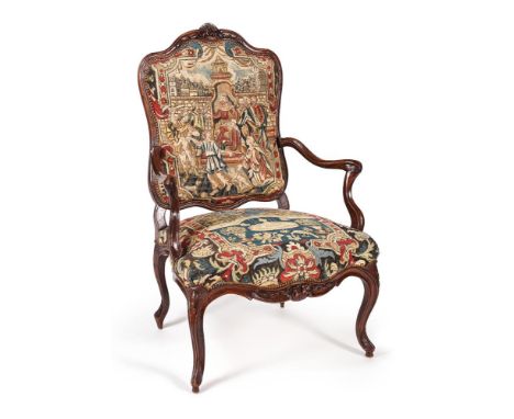 A LOUIS XV CARVED WALNUT AND NEEDLEWORK UPHOLSTERED ARMCHAIRMID 18TH CENTURY109cm high, 78cm wide, 76cm deepFor a related exa