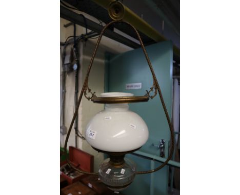 Brass framed hanging oil lamp with glass reservoir and opaque glass shade.(B.P. 24% incl. VAT)