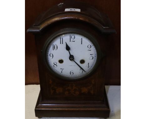Early 20th Century oak two train mantel clock with inlaid foliate decoration and Arabic enamel face. 32cm high approx. (B.P. 