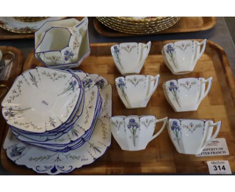 21 piece Shelley art deco design tea service with enamelled flowers, registration no. 723404. (B.P. 24% incl. VAT) CONDITION 