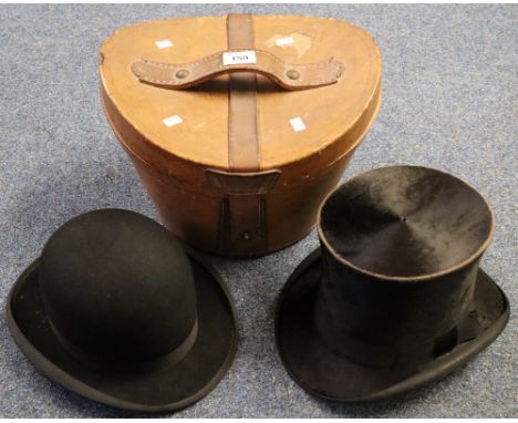 Leather hat box containing two vintage men's hats, one is a black bowler hat with 'British Manufacture' label (size 6 3/4) an