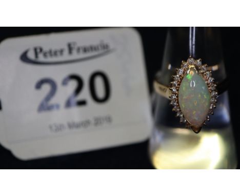 14ct gold opal and diamond ring. (B.P. 24% incl. VAT) CONDITION REPORT: Size M. 1 diamond is missing.