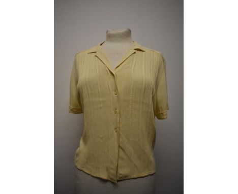 A 1940s pale yellow blouse, with pin tuck details to textured fabric, larger size.