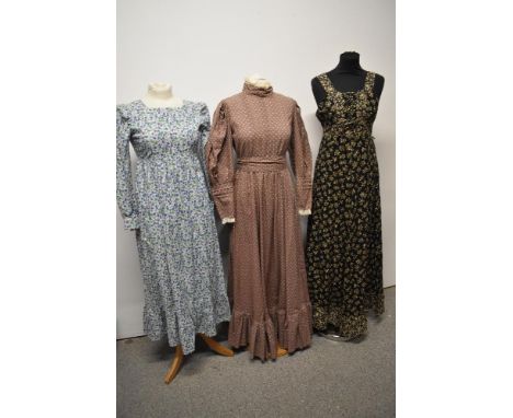 Three vintage dresses, including beige 1970s prairie style Laura Ashley maxi dress.
Each dress appears to be in good used con