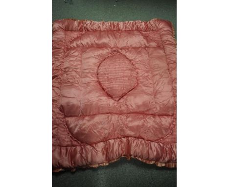 A vintage 1930s pink satin eiderdown.
150cm x 132cm some patches of staining and fading.