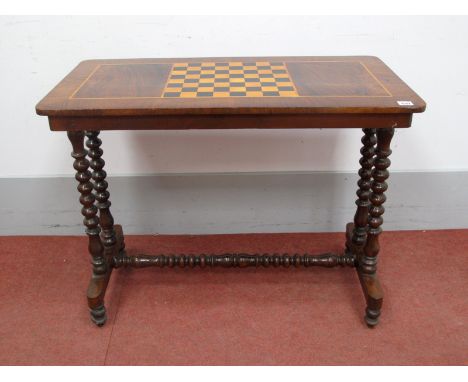 A XIX Century Walnut Games Table, the rectangular top with boxwood and ebonised chess board, on bobbin turned supports with c