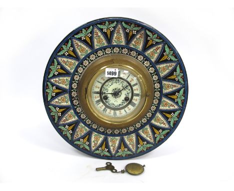 A Late XIX Century Mantle Clock, the pottery surround painted in enamels with flowers, the white enamel dial with black Roman