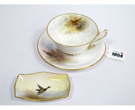 A Royal Worcester Porcelain Teacup and Saucer, painted by James Stinton, signed, with a Woodcock and a Grouse, gilt marks; A 