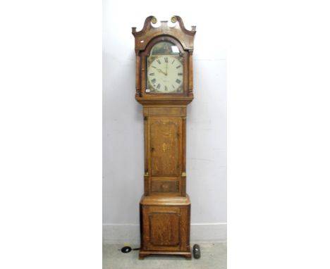 An XVIII Century Oak and Mahogany Longcase Clock, with swan neck pediment, arched door and column supports, the arched white 