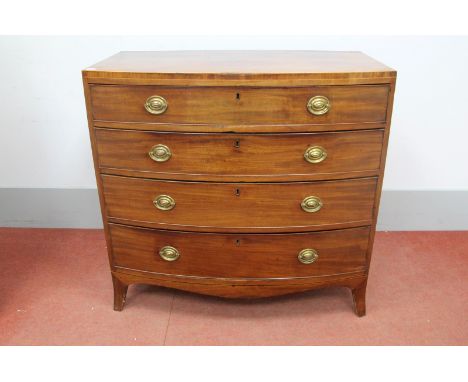 An Early XIX Century Mahogany Bow Fronted Chest of Drawers, with caddy top over four long drawers on bracket feet.