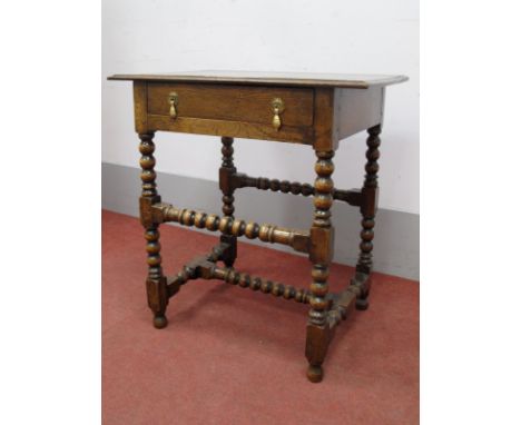 A XVII Century Style Oak Side Table, the top with moulded edge over a single drawer on bobbin turned and block supports unite