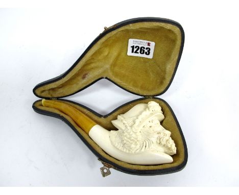 A XX Century Meerschaum, Pipe, carved with a cavalier wearing a feathered hat, 17cm long, cased.