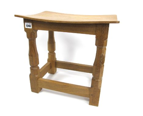 A Robert Thompson (Mouseman) Oak Stool, of rectangular form, with dished top raised on four octagonal legs joined by stretche