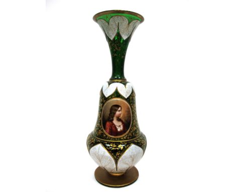 A Late XIX Century Bohemian Glass Vase, the green ground overlaid in white with stylised leaves and gilt foliage, the central