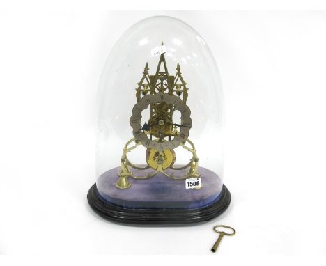 A Late XIX Century Gothic Style Brass Skeleton Clock, with three spires and turned feet, the shaped circular dial with black 