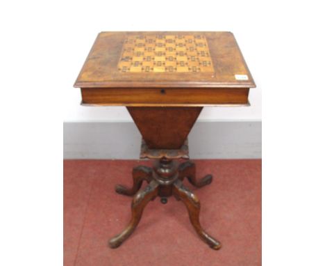 A Mid XIX Century Walnut Games/Sewing Table, with a chess board top, fitted interior, tapering basket, on carved cabriole leg