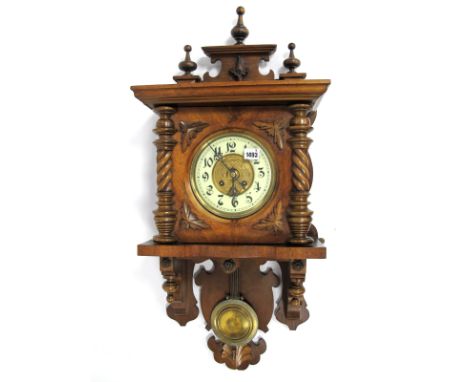A Late XIX Century Mahogany Drop End Vienna Style Wall Clock, with applied carved decoration and turned columns, the cream en