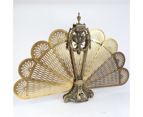 A Victorian brass peacock firescreen, height 67cm 