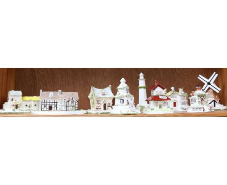 A shelf of 9 Coalport Cottages, boxed 