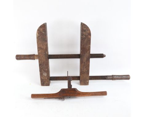 A large early wooden adjustable cramp and an Antique granny's tooth woodworking tool (2) 