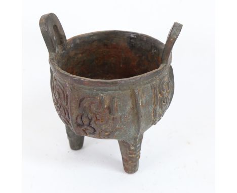 A Chinese cast-iron Archaic style Ding tripod censer, Archaic character mark on base, height 15cm, diameter 12cm 