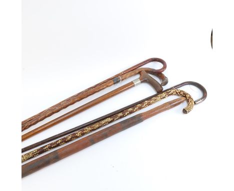 A Tribal hardwood club with painted animals, length 81cm, and a group of Vintage walking canes (6) 