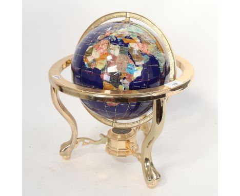 A brass and hardstone table-top globe, with compass inset base, overall height 33cm, globe diameter 23cm 