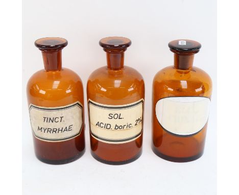 A Vintage set of 3 brown glass apothecary bottles and stoppers, height 23cm (3) 