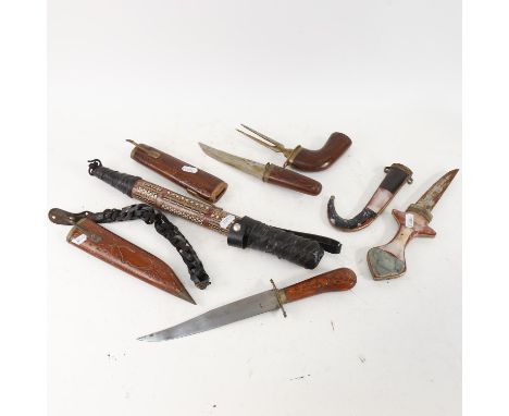 A reproduction Middle Eastern hardstone mounted dagger and scabbard, 2 Oriental knives, and an inlaid bullwhip handle (4) 