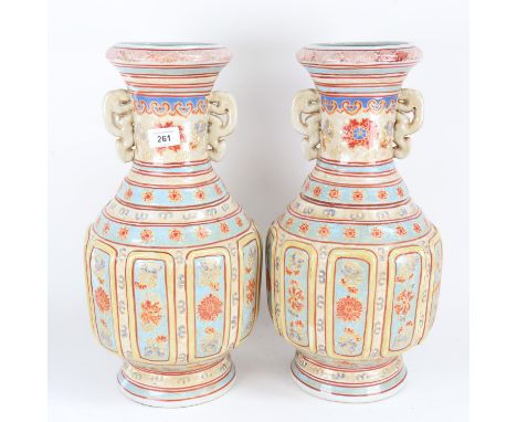 A pair of Chinese ceramic baluster vases, with glazed and enamelled decoration, with character and seal marks on base, height