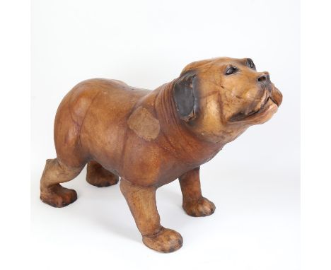 A life-size leather covered model Bulldog footstool, length 70cm 