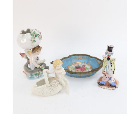An ornate painted and gilded porcelain dish, with gilt-metal mount, length 22cm, and 3 other ceramic figures (4) 