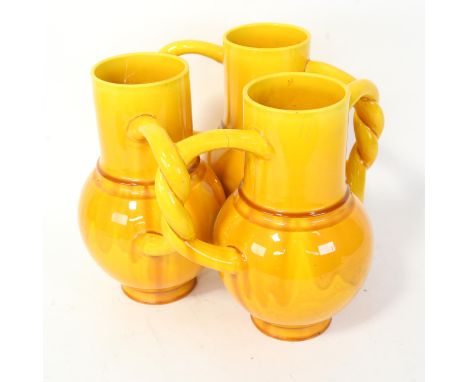 BURMANTOFTS - a faience pottery yellow glaze fuddling cup, model no. 1788, height 22cm, width 28cm 