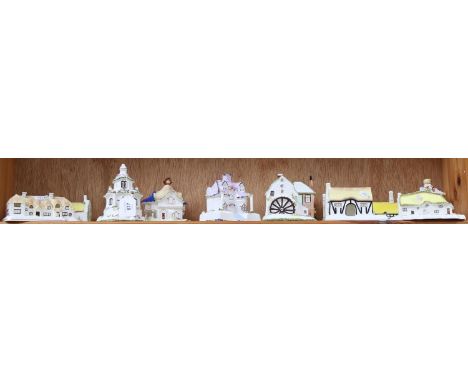 A shelf of 11 Coalport Cottages, boxed 