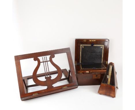A 19th century mahogany folding travelling writing slope, metronome, and lyre music stand (3) 