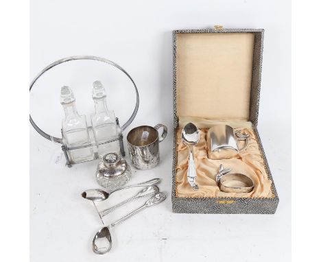 A silver-mounted inkwell, a Continental silver spoon and pusher, oil jar set in plated stand, and a cased WMF christening set