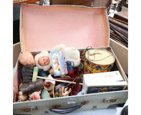 A suitcase of Vintage toys, including a drum, doll, crib etc 
